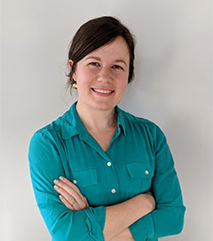 headshot of woman in blue shirt