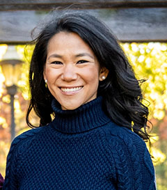 headshot of woman in black sweater