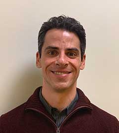 headshot of man with brown hair