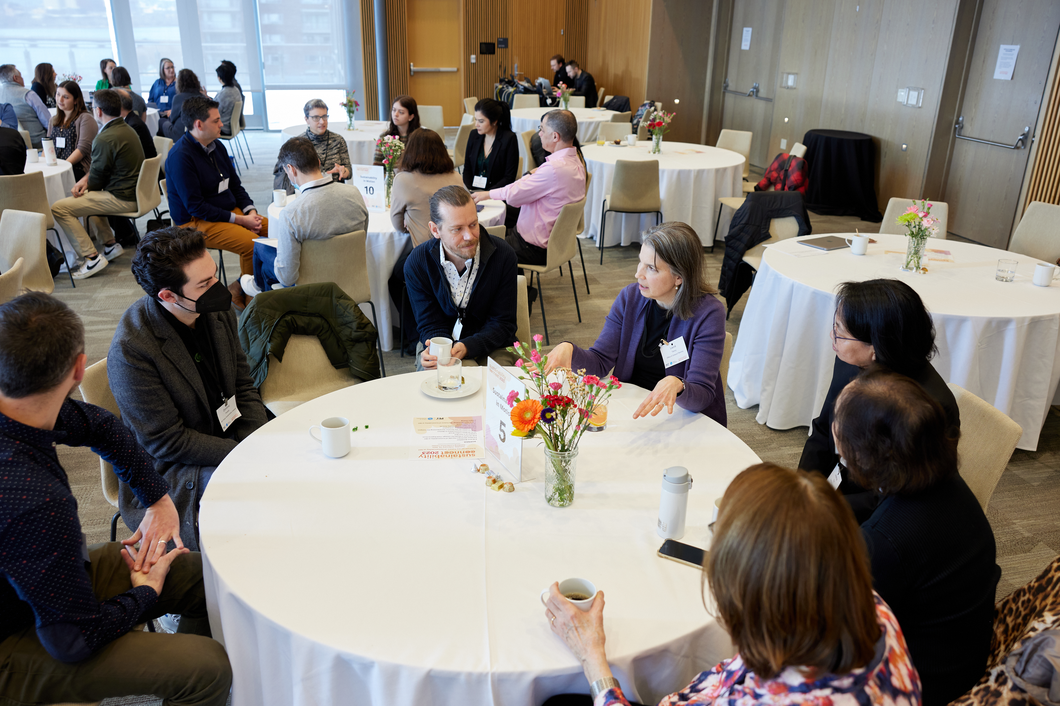 people gathered around a table talking