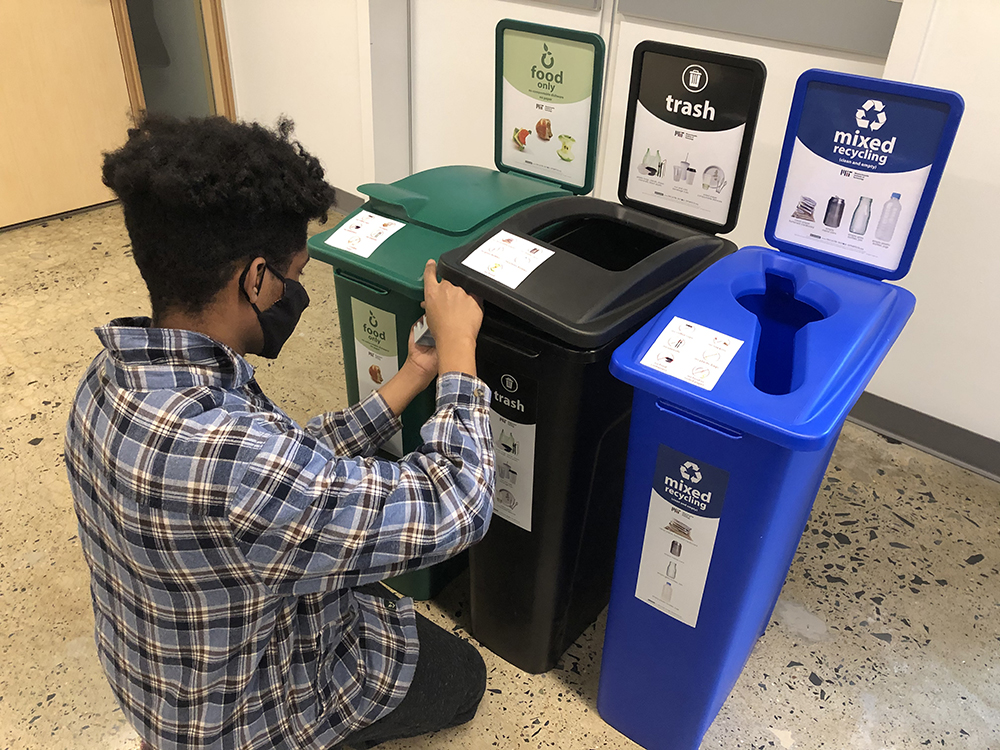 student assembles three bin waste station