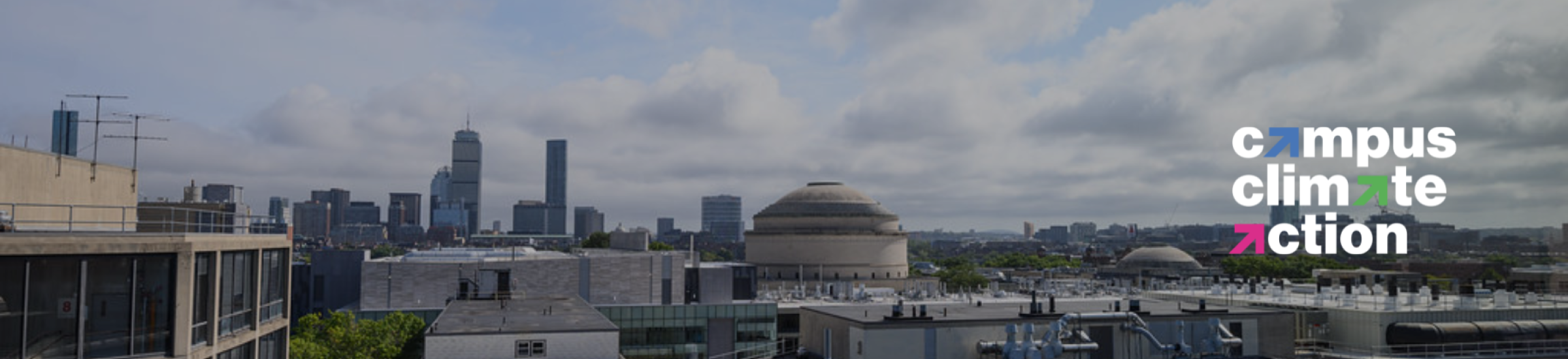 aerial image of MIT campus with Boston skyline in view