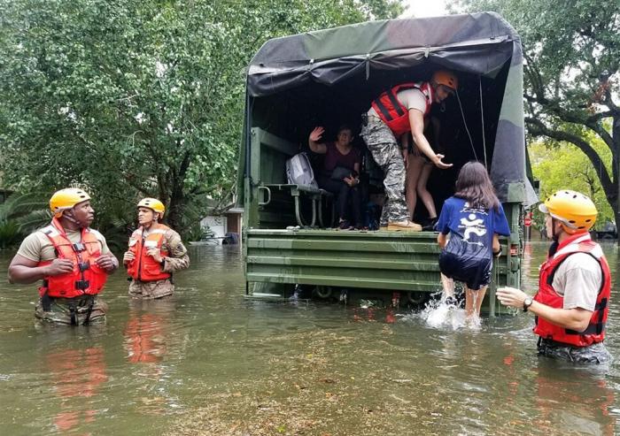 Texas Army National Guardsmen help Houston residents affected by flooding caused by Hurricane Harvey board a military vehicle. "With an event like this," says MIT associate professor of urban planning Brent Ryan, "it becomes viscerally evident whic...