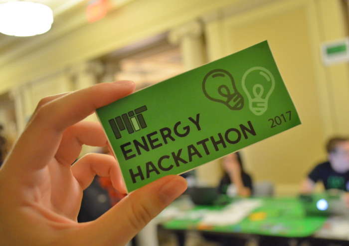 MIT Energy Hackathon leaders handed out stickers at this year's registration tables.Photo: Fatima Husain