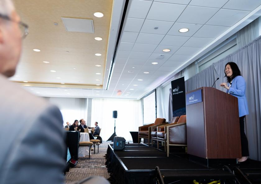 At the 2025 MIT Energy Initiative Spring Symposium, Evelyn Wang (at lectern), the MIT vice president for energy and climate, joined MITEI Director William H. Green to discuss how collaborations across campus can help solve the data center challenge.