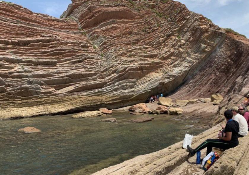 The composition and location of rock strata help scientists date when biomarkers were formed and deposited. Offshore in Zumaia, Basque Country (Spain), variations in the thickness and composition of sedimentary rocks show periodic changes in th... The composition and location of rock strata help scientists date when biomarkers were formed and deposited. Offshore in Zumaia, Basque Country (Spain), variations in the thickness and composition of sedimentary rocks show periodic changes in th...