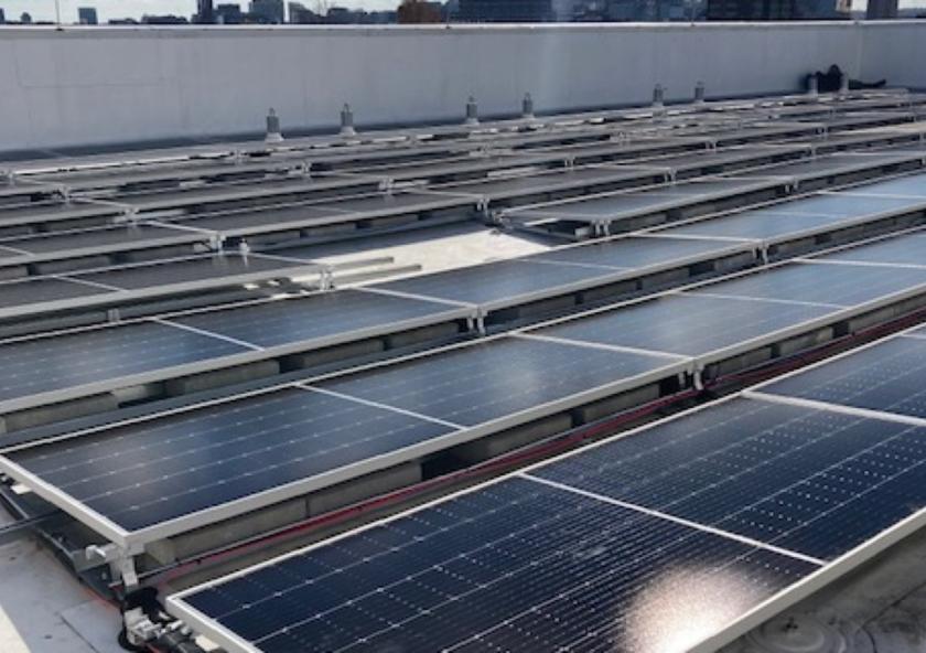 New solar panels are installed on the roof of MIT Building W46. New solar panels are installed on the roof of MIT Building W46.