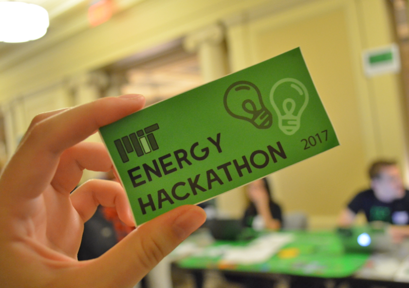 MIT Energy Hackathon leaders handed out stickers at this year's registration tables.Photo: Fatima Husain