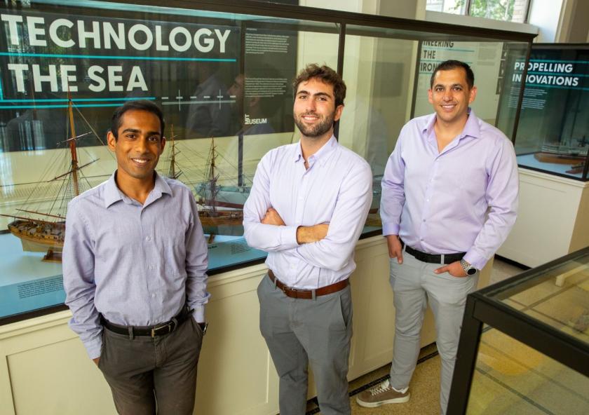 "The Nuclear Ship Safety Handbook" co-authors (left to right) Anthony Valiaveedu, Nat Edmonds, and Jose Izurieta pose in MIT's Hart Naval Gallery.