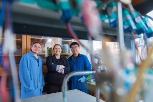
              Professor Ariel Furst (center), undergraduate Rachel Ahlmark (left), postdoc Gang Fan (right), and their colleagues are employing biological materials, including DNA, to achieve the conversion of carbon dioxide to valuable products.
...