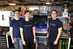 
              Optigon co-founders (from left to right) Brandon Motes, Dane deQuilettes, and Anthony Troupe stand with a benchtop version of the measurement tool they believe will help accelerate the pace of solar power and other clean energ...