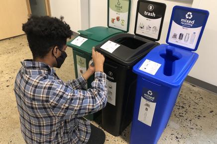 student assembles three bin waste station