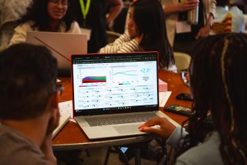 Undergraduate students explore the En-ROADS climate simulator.