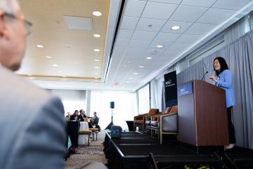 At the 2025 MIT Energy Initiative Spring Symposium, Evelyn Wang (at lectern), the MIT vice president for energy and climate, joined MITEI Director William H. Green to discuss how collaborations across campus can help solve the data center challenge.