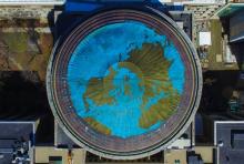 aerial view of MIT dome covered in earth tapestry