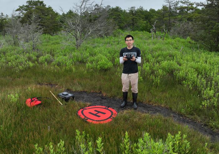 Graduate student Ernie I. H. Lee uses drone imaging and machine learning to help map salt marsh species, plant height, and shoots per bed area.