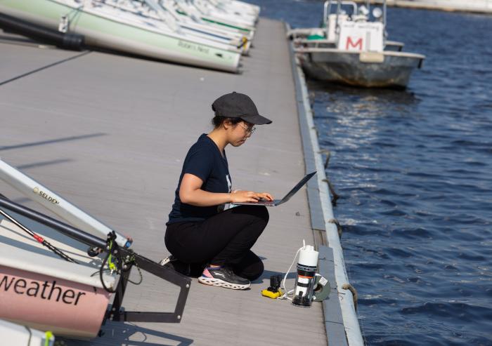 Charlene Xia, pictured at the MIT Sailing Pavilion, tests her microbiome monitoring system in the Charles River.
Photo: John Freidah, MIT Mechanical Engineering
Charlene Xia, pictured at the MIT Sailing Pavilion, tests her microbiome monitoring system in the Charles River.
Photo: John Freidah, MIT Mechanical Engineering