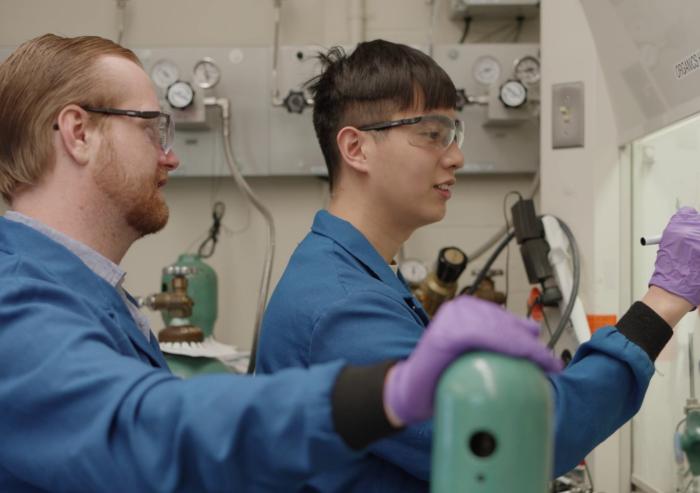 Glen Junor (left) and Fang-Yu Kuo work in the lab. 