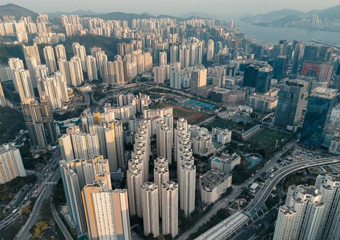 A dense high-rise development in Kowloon, Hong Kong, reflects the speed and scale of urbanization across the Asia-Pacific region, where cities are expanding rapidly to accommodate growing populations.