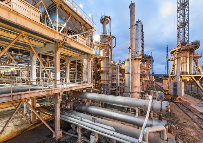 Today, most ammonia is produced using the Haber-Bosch process, a century-old method that relies on fossil fuels, in facilities like the one pictured. MIT researchers are developing computational approaches to identify materials that could enable a more sustainable alternative.