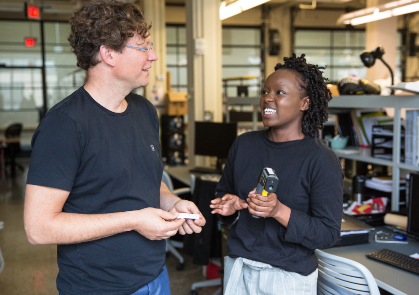Professor Reinhart (left) and architecture graduate student Hellen Rose Anyango Awino discuss a class assignment on measuring thermal comfort.Photo: Kelley Travers/MITEI