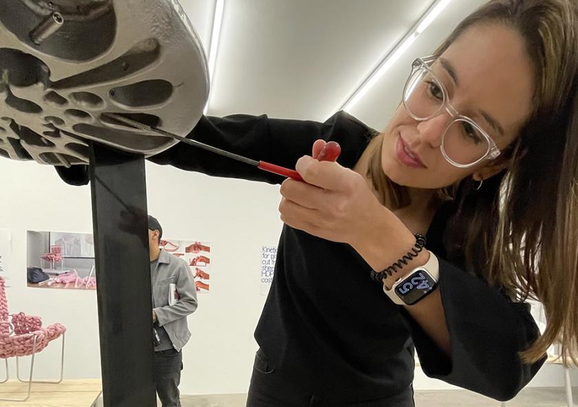 Maria Risueño Dominguez SM '22 demonstrates the adaptability of her furniture system at the opening of the “The Next 150 Year Chair” exhibit.
Photo: Maria Iacobo
Maria Risueño Dominguez SM '22 demonstrates the adaptability of her furniture system at the opening of the “The Next 150 Year Chair” exhibit.
Photo: Maria Iacobo