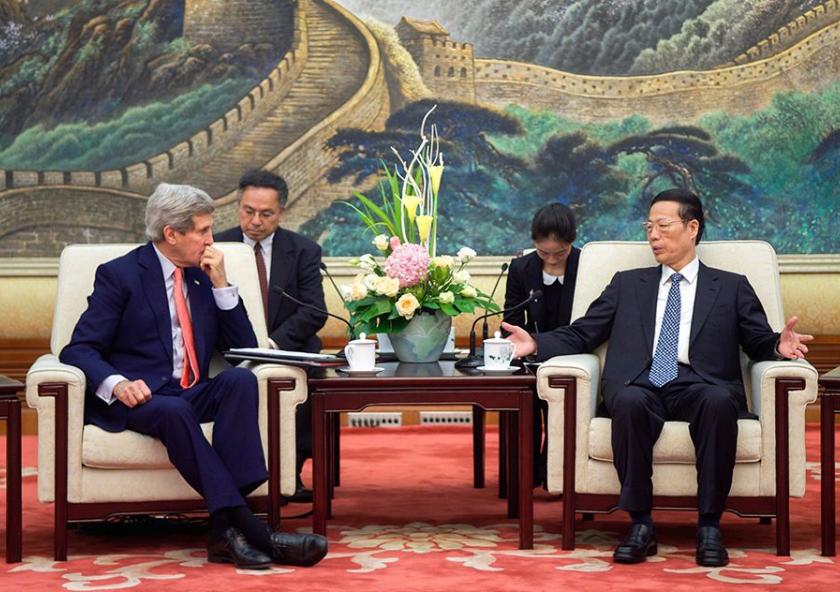 Zhang Gaoli (seated, right), vice premier of China, whose portfolio includes environmental issues, speaks with U.S. Secretary of State John Kerry at the outset of a meeting about climate change and other topics at the Great Hall of the People i...