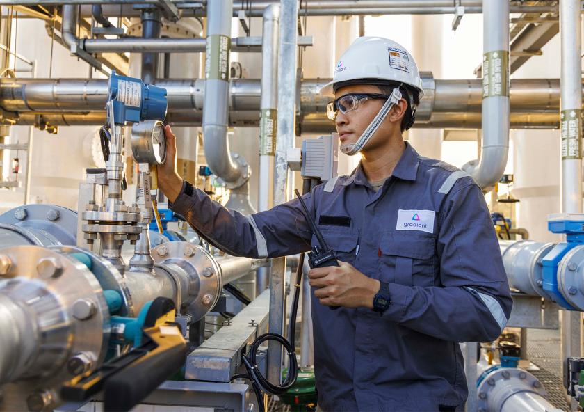 The mission of Gradiant, a firm started by MIT alumni, is to preserve water for generations to come in the face of rising global demand through innovation. Here, a worker inspects a Gradiant water treatment system. The mission of Gradiant, a firm started by MIT alumni, is to preserve water for generations to come in the face of rising global demand through innovation. Here, a worker inspects a Gradiant water treatment system.