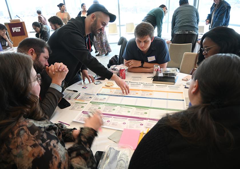 Living Climate Futures Symposium participants worked together to identify potential pros, cons, and trade-offs of allowing a data center to be built in a fictitious community. 