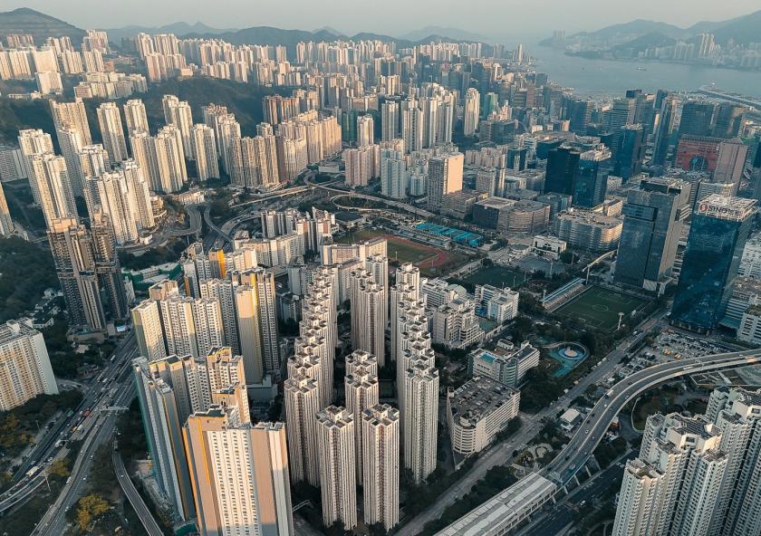 A dense high-rise development in Kowloon, Hong Kong, reflects the speed and scale of urbanization across the Asia-Pacific region, where cities are expanding rapidly to accommodate growing populations.