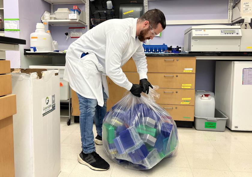 Normand Desrochers, MIT EHS technician, picks up pipette tip boxes and conical tube racks to be recycled.
Photo: Hao Nguyen
Normand Desrochers, MIT EHS technician, picks up pipette tip boxes and conical tube racks to be recycled.
Photo: Hao Nguyen