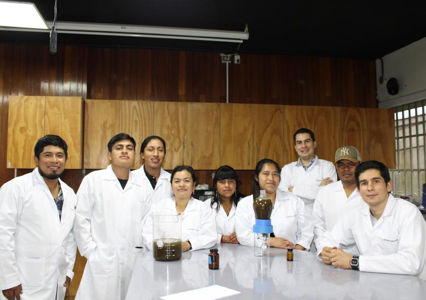 Members of the Ija´tz and Innoc farming cooperatives pose in the new University del Valle de Guatemala essential oil extraction lab, led by Rodrigo Aragon (far right), with Elizabeth (fourth from left). 