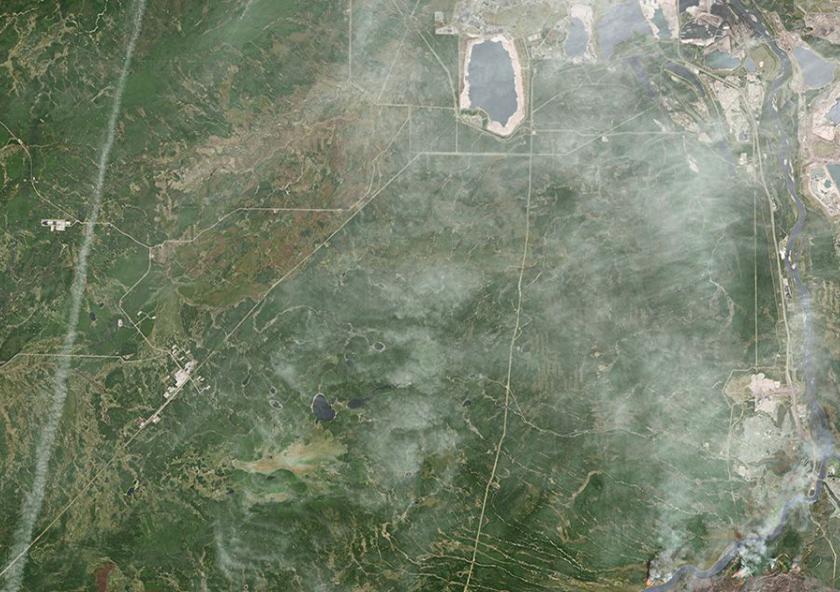 A destructive wildfire burned through Canada’s Northern Alberta region, razing neighborhoods in Fort McMurray and displacing tens of thousands of residents. Image: NASA Earth Observatory