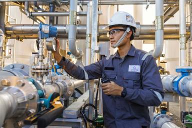 The mission of Gradiant, a firm started by MIT alumni, is to preserve water for generations to come in the face of rising global demand through innovation. Here, a worker inspects a Gradiant water treatment system.