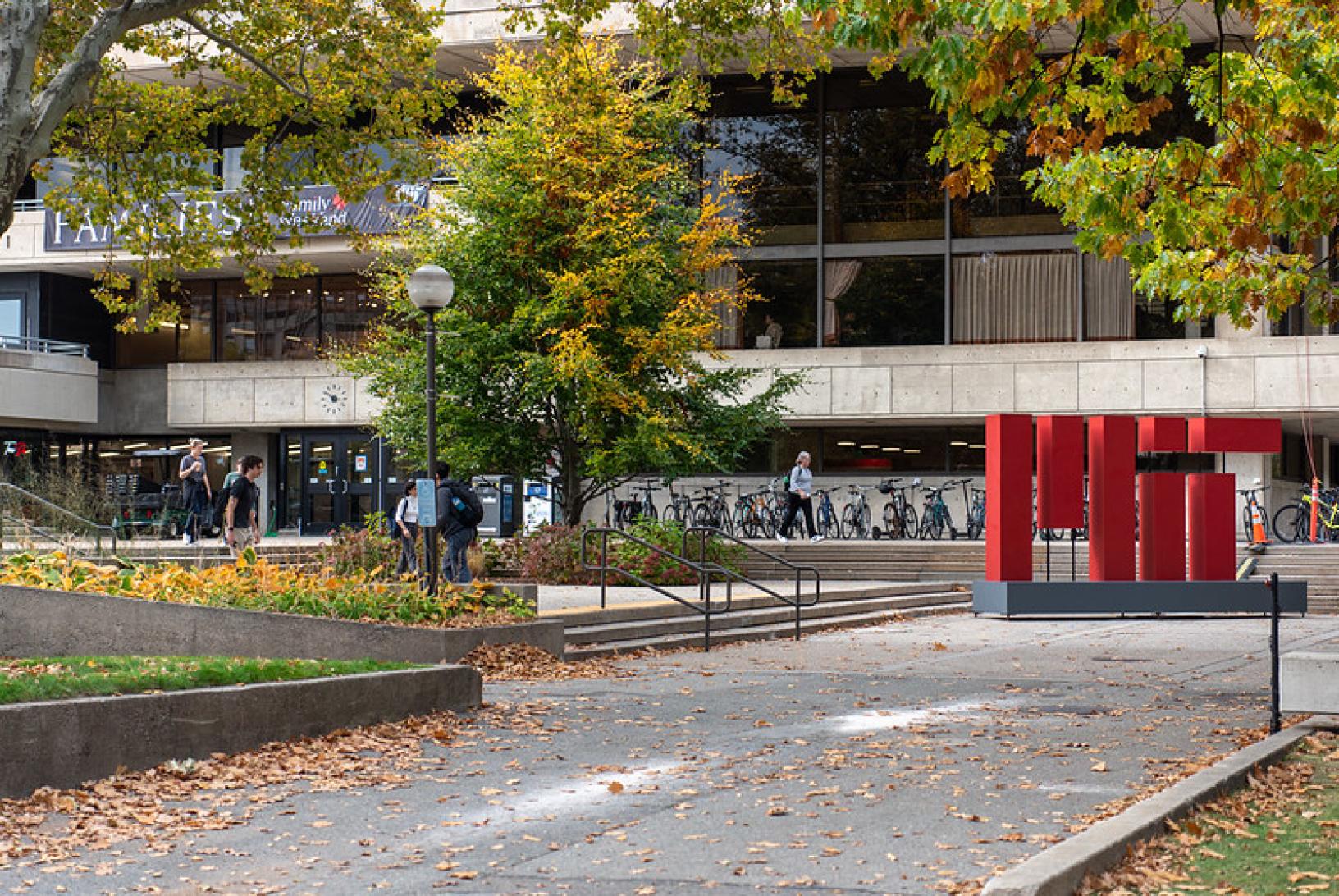 a gray building with large MIT letters in front