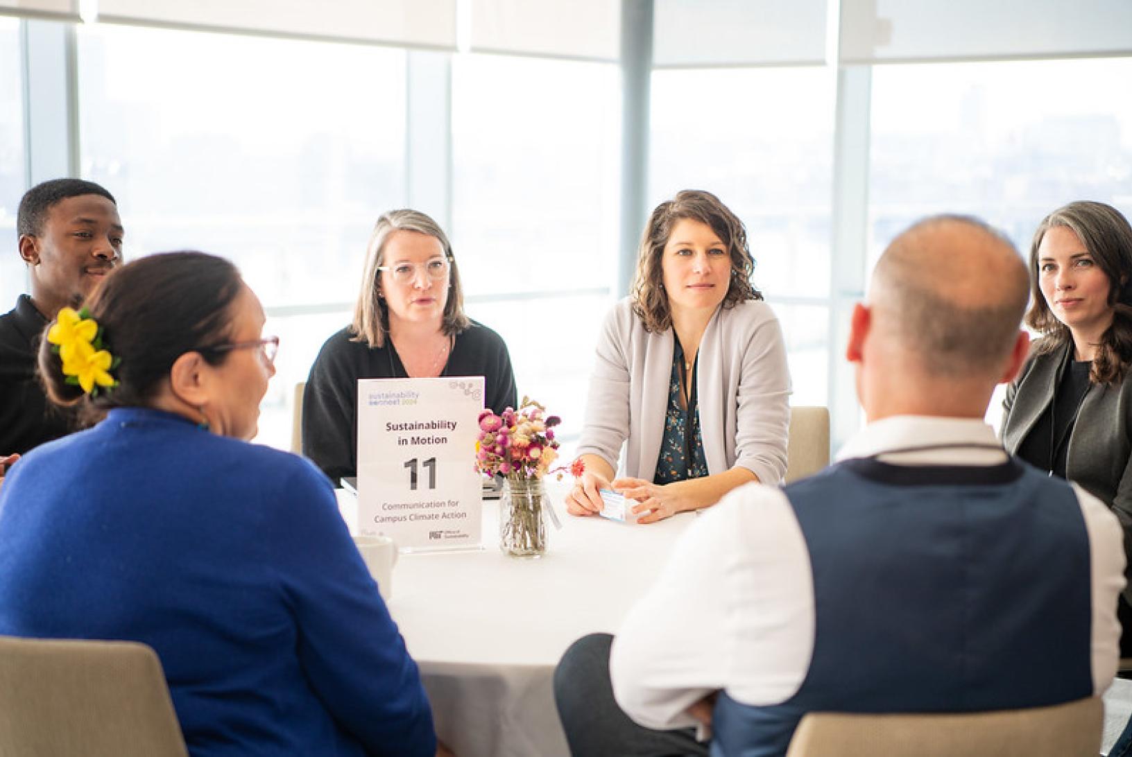 people sit around a table
