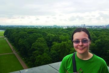 Carissa Skye a third-year physics major who interned at Shell in Hamburg, Germany, poses at the top of the Hamburg Planetarium.Photo: Noa Knoerl-Morrill