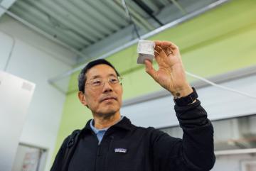 
              Professor Yet-Ming Chiang holds a mechanical test specimen of decarbonized cement.
              Credit: Bearwalk Cinema
      