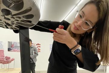 
              Maria Risueño Dominguez SM '22 demonstrates the adaptability of her furniture system at the opening of the “The Next 150 Year Chair” exhibit.
              Photo: Maria Iacobo
      