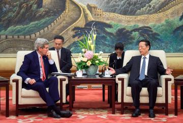 Zhang Gaoli (seated, right), vice premier of China, whose portfolio includes environmental issues, speaks with U.S. Secretary of State John Kerry at the outset of a meeting about climate change and other topics at the Great Hall of the People i...