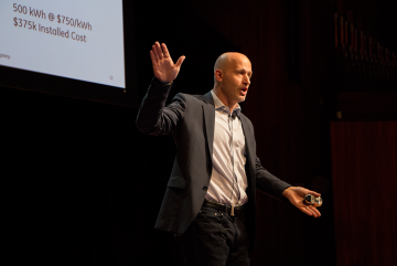 Glen Merfeld, product science leader at GE Global Research, points to almost 40,000 wind turbines installed globally during the 2016 Materials Day Symposium at MIT.