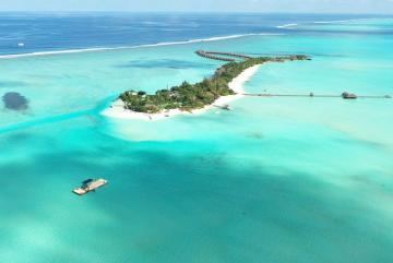 In the lower left corner of this photograph, researchers prepare a submersible device. “Together with our collaborators in the Maldives, we are designing, testing, building, and deploying submersible devices that, based simply on their geometry i...