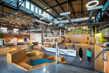 Greentown Labs is the largest clean technology incubator in North America by both square feet and the number of member companies. The open layout of its entrance, shown here, is designed to host events and encourage collaboration.Images:  Barr...