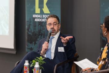 Daron Acemoglu speaks on stage with Aisha Losche. “I believe liberal democratic institutions, together with the norms that support them, are one of the greatest human achievements,” he said.