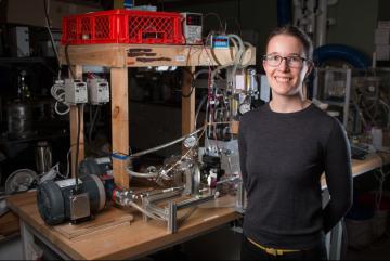 Emily Tow PhD '17, displays equipment she developed to measure the effects of different pressure levels on the way microorganisms build up on membranes used for desalinating water.Courtesy of the researchers