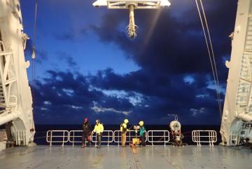 Scientists prepare to deploy an underway CTD from the back deck of a research vessel.Image: Amala Mahadevan