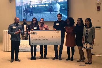 Symbrosia co-founder and CEO Alexia Akbay, second from left, and co-founder and CTO Jonathan Simonds, fourth from right, pose with members of MIT’s Water Club following the MIT Water Innovation Prize Thursday.Credit: Zach Winn