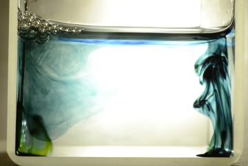 
              Dyes are used to reveal the concentration levels of carbon dioxide in the water. On the left side is a gas-attracting material, and the dye shows the carbon dioxide stays concentrated next to the catalyst.
              Credit...