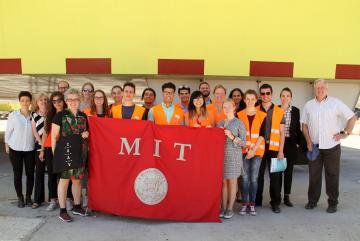 MIT students, students from the University of Venice, and faculty members from both institutions pose in front of Venice's experimental floodgates as part of a collaborative summer workshop. Photo: Lily Keyes