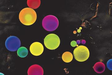 To combat global micronutrient deficiency crises, MIT researchers developed novel materials that protect fragile nutrients under harsh cooking and storage conditions. The microparticles seen here are made of biodegradable polymers that dissolve in the stomach to release encapsulated vitamins and minerals.